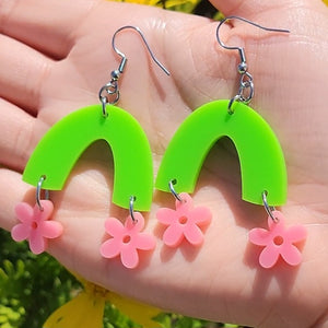 pink flowers hanging from light green arch earrings